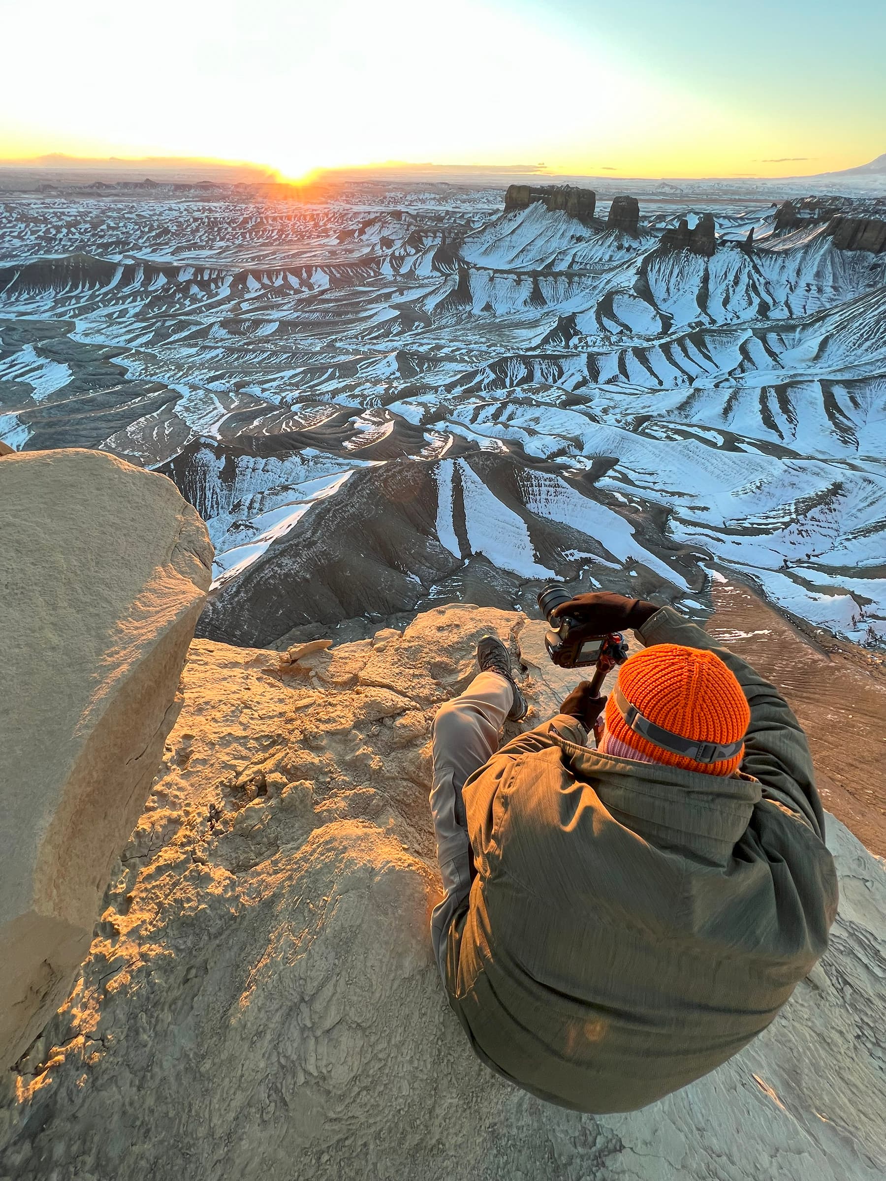 Factory Butte sunrise from a cliff edge