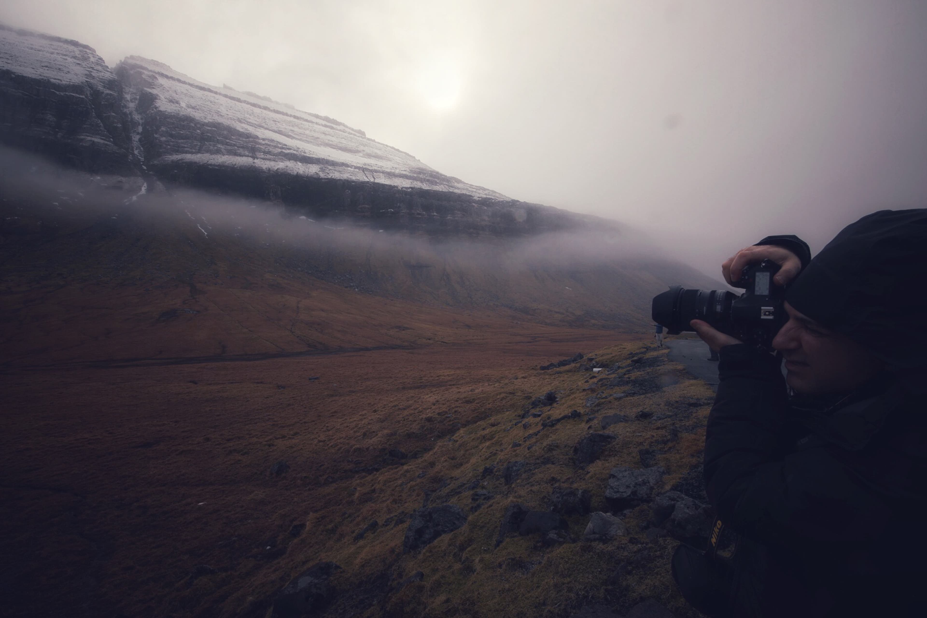 Photographer working in Faroe Islands conditions