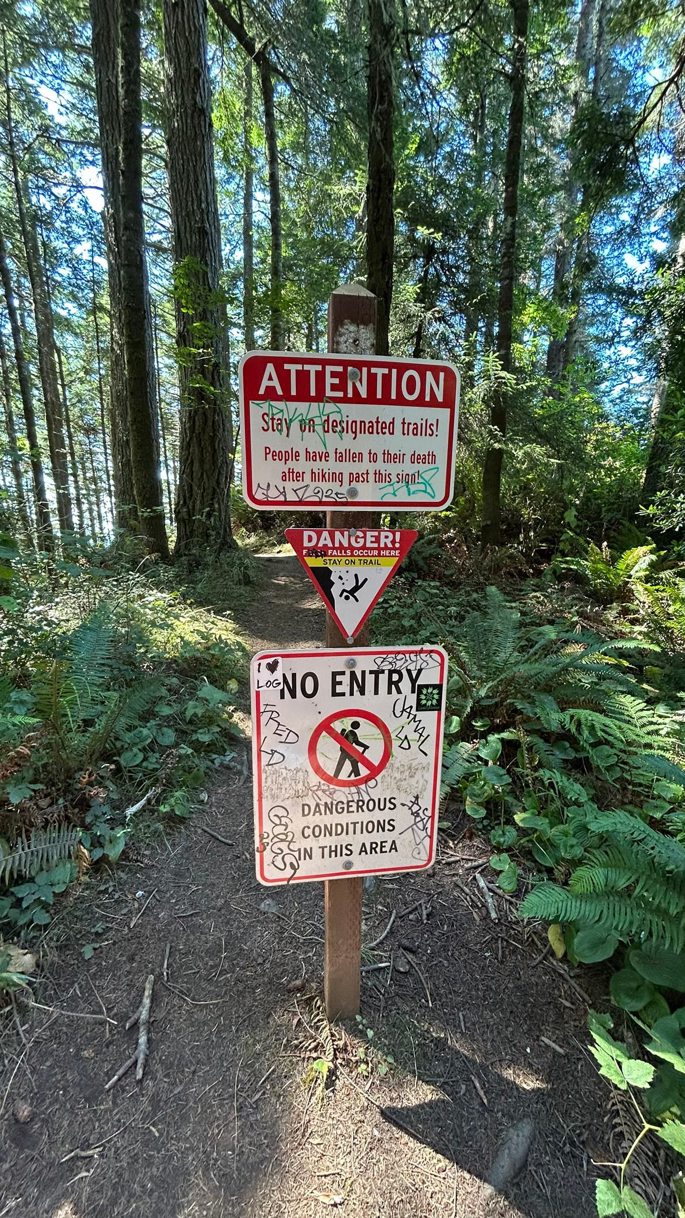 Warning sign at Natural Bridges reminding visitors about terrain hazards